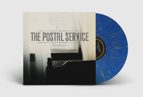 POSTAL SERVICE – GIVE UP (20TH ANNIVERSARY BLUE W/METALLIC SILVER) - LP •